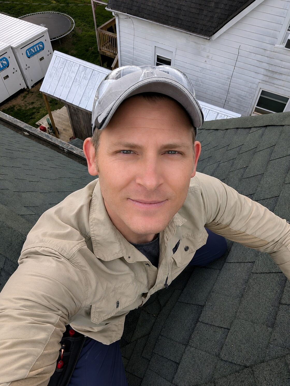 Shawn Griggs inspecting roof flashing on a Kentucky home