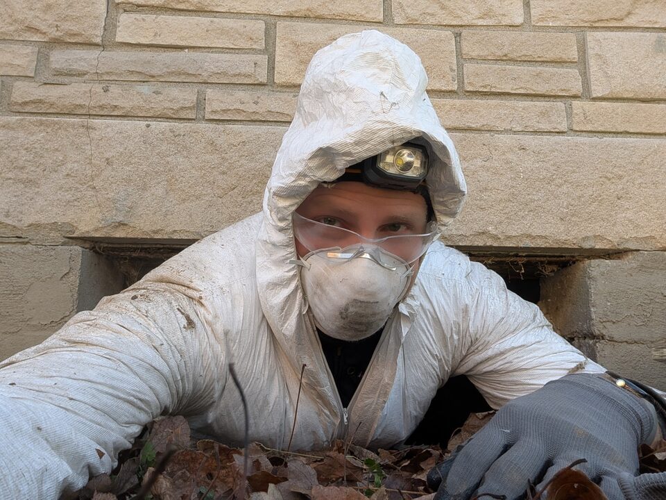 Shawn Griggs inspecting a home crawlspace